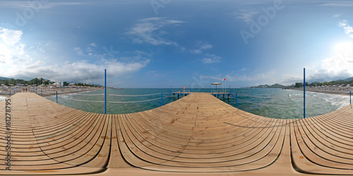 View from a wooden pier on the sea and beach, mountains, sky. 360 degree spherical panorama from Turkey, Antalya, Kemer.