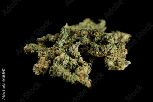 Heap of weed buds on black background, closeup