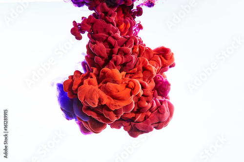 Ink swirling in water, Color drop in water photographed in motion