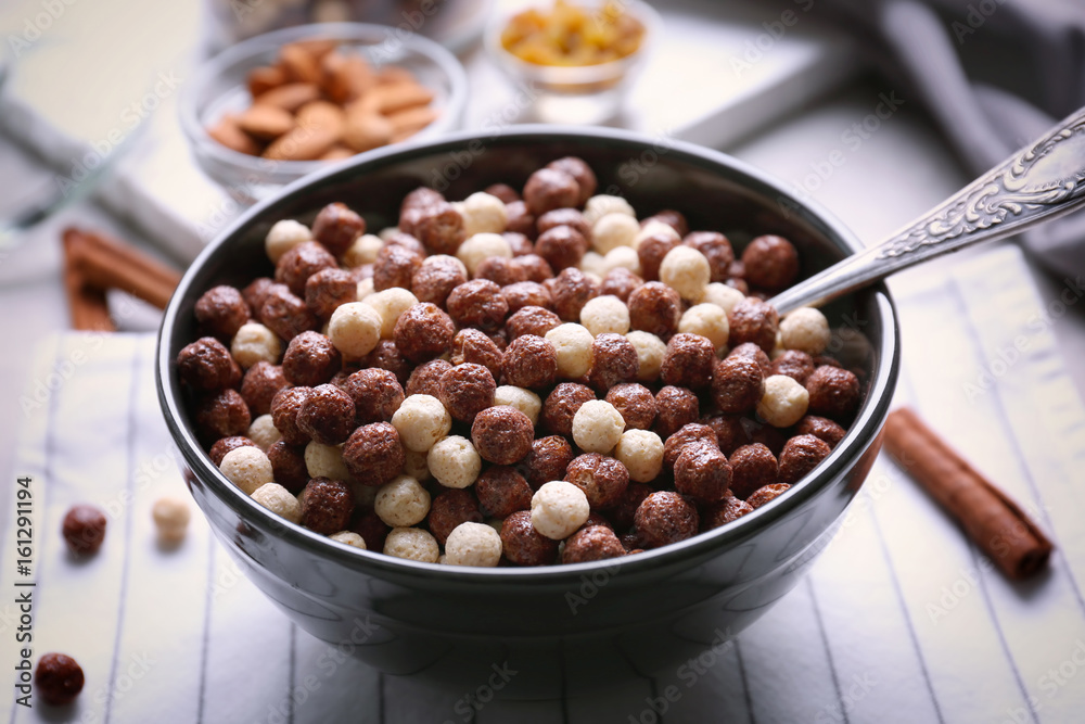 Bowl with delicious cereal balls on table Bowl with delicious cereal balls on table