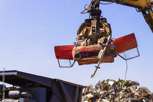 Extra shoot. Crane lift old car for recycling