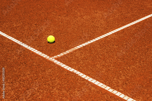 Tennis ball on tennis court. Clay surface. © Ivan