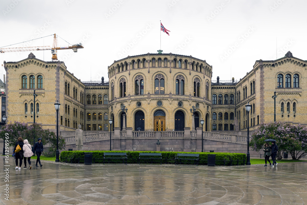 Parliament of Oslo with a cloudy sky.