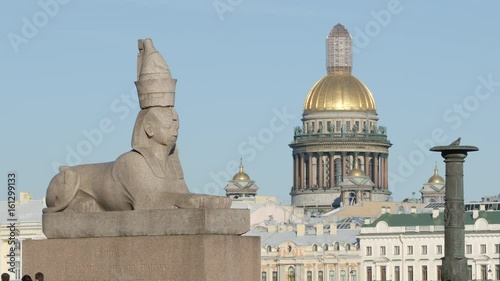 CLOSE UP: Isaac cathedral and egyptian antique sphinx on an embankment on Vasilievsky island - St. Petersburg, Russia photo