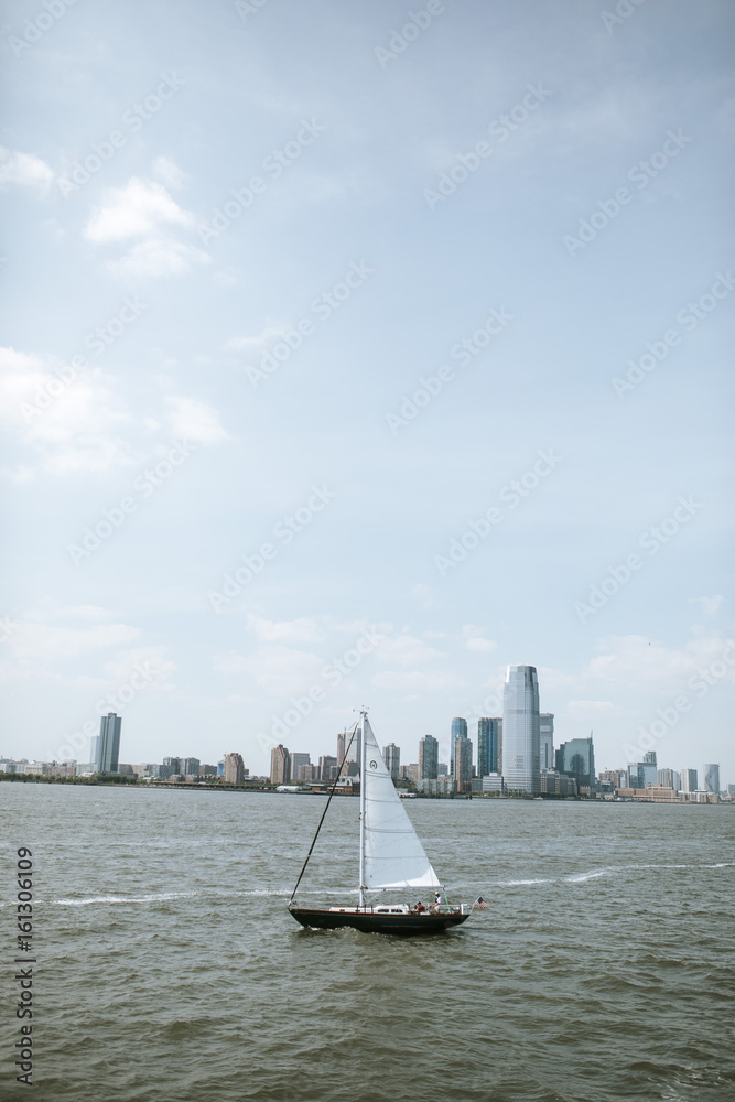 sailboat in front of manhatten skyline sailboat in front of manhatten skyline