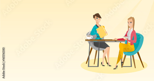 Two businesswomen during business meeting.