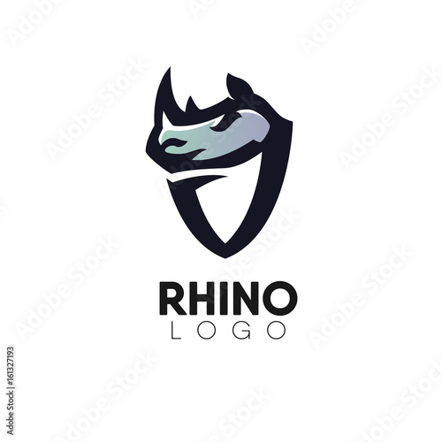 Rhinos head with shield creative logo design template.