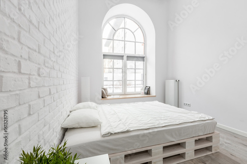 White bedroom with pallet bed