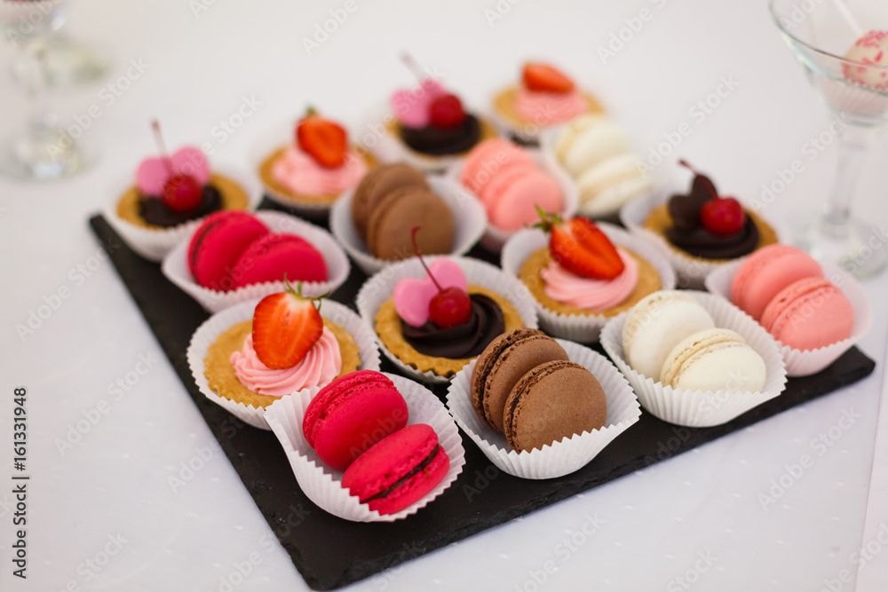 French macaroni on a plate - macarons, shoot made with a small depth of field French macaroni on a plate - macarons, shoot made with a small depth of field