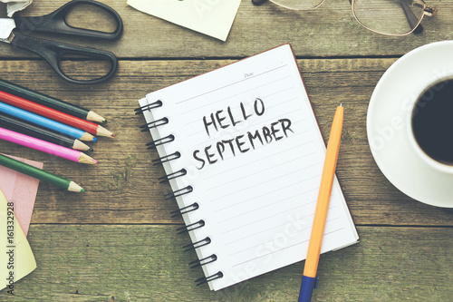 september text on notepad with stationary