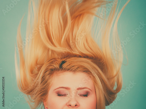 Obraz na plátne Woman with closed eyes and windblown hair