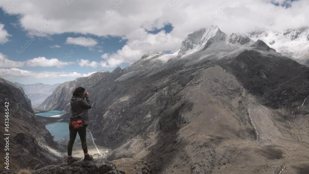 Hispanic woman on the top of the Andean mountains during the Santa Cruz Trek takes pictures of the wonderful panorama. 4k Hispanic woman on the top of the Andean mountains during the Santa Cruz Trek takes pictures of the wonderful panorama. 4k