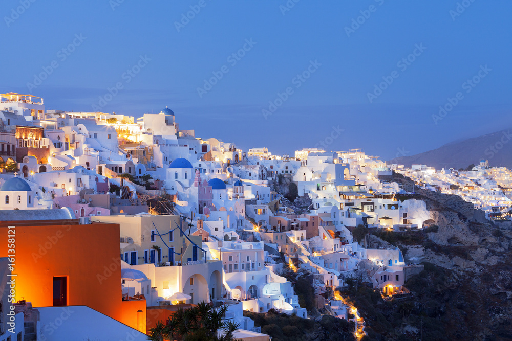 Blue domes in Santorini at sunset 