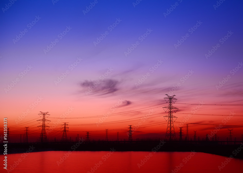 High voltage towers, silhouette in the evening
