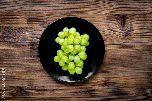 healthy food with green vegetables, fruits for dinner on rustic table background top view photo