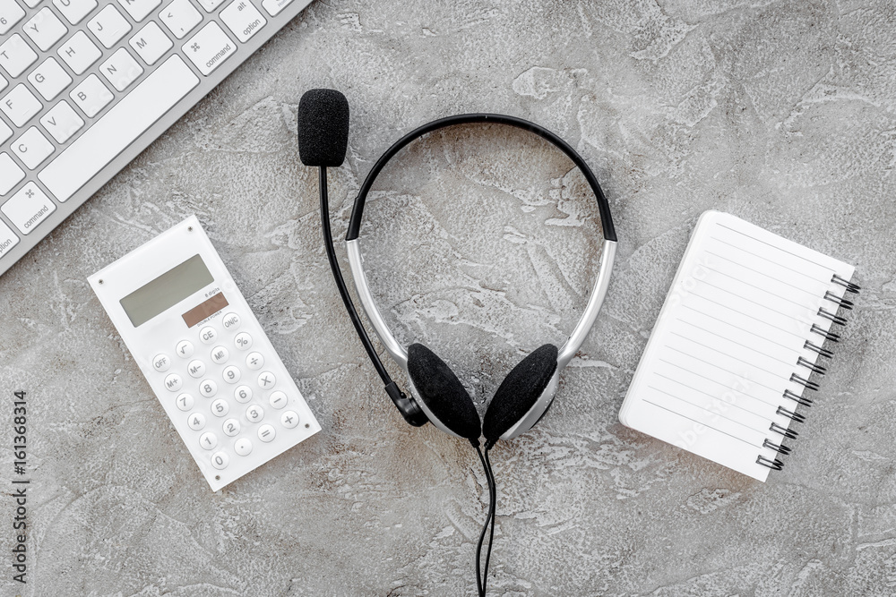 contact us for company feed back with headset and notebook stone desk background top view mock-up contact us for company feed back with headset and notebook stone desk background top view mock-up