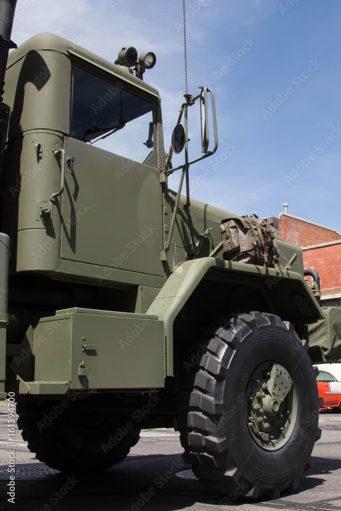 Massive military truck parked on the street