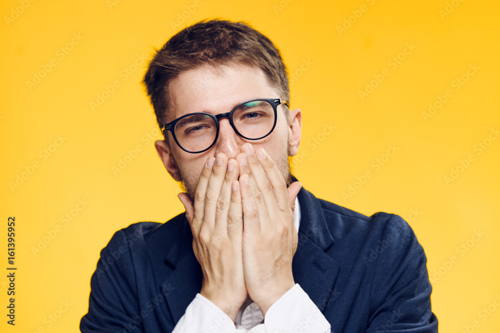 Businessman yawning, businessman in glasses, businessman on yellow background portrait Businessman yawning, businessman in glasses, businessman on yellow background portrait