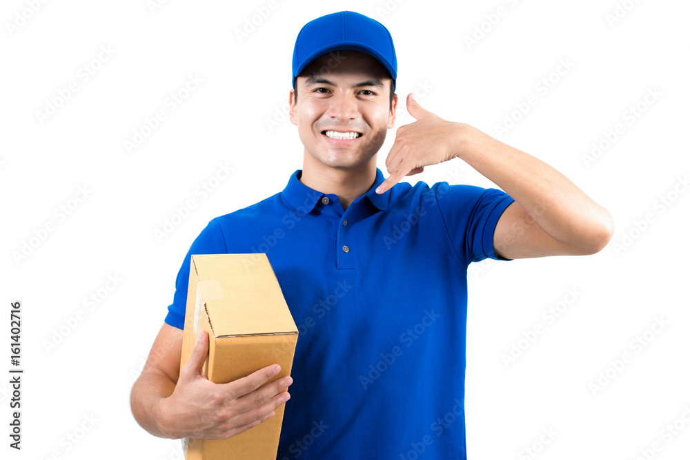 Smiling handsome delivery man holding box and making call me gesture Smiling handsome delivery man holding box and making call me gesture