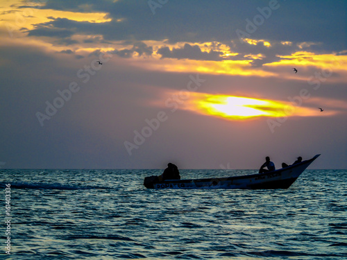 fishermen in the sunset