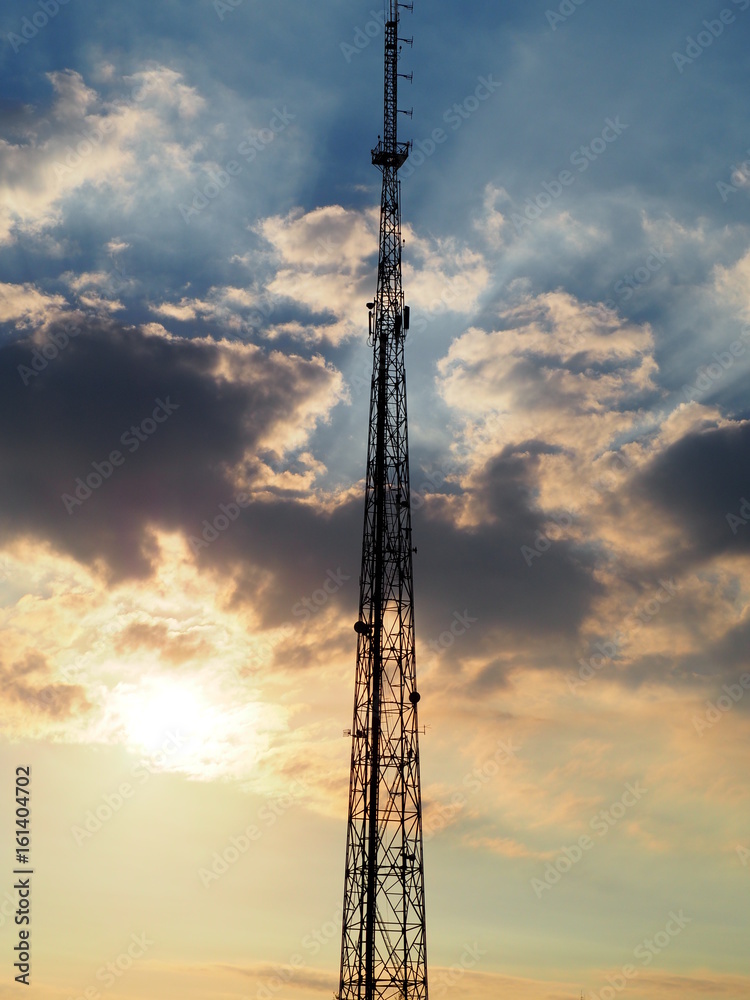 COMMUNICATION TOWER WITH EPIC SUNSET CLOUDY SKY