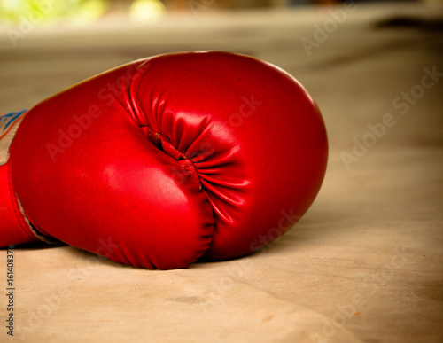 Old red boxing gloves on canvas © n_u_t