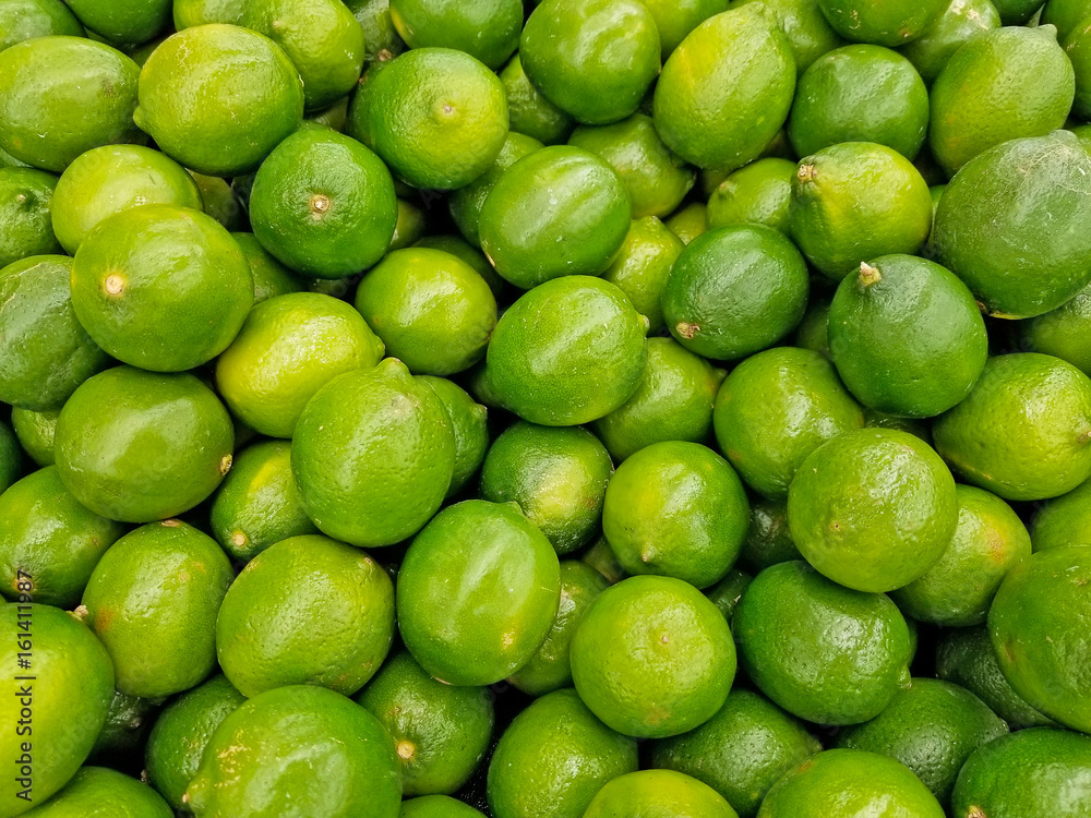 whole limes pile display in produce aisle whole limes pile display in produce aisle