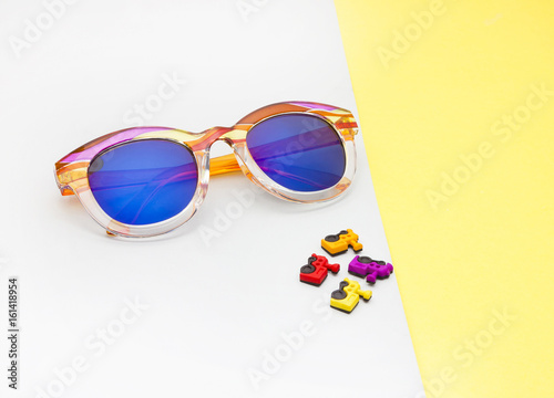 CREATIVE SHOOT OF SUNGLASSES WITH COLOURFUL BACKGROUNDS AND COOL PROPS