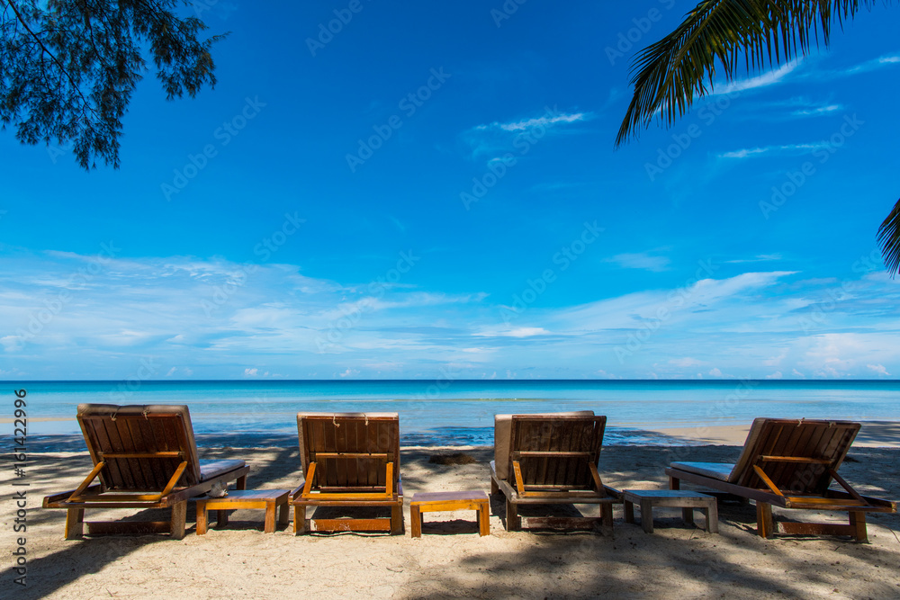 Beautiful beach. Chairs on the sandy beach near the sea. Summer holiday and vacation concept. Thailand