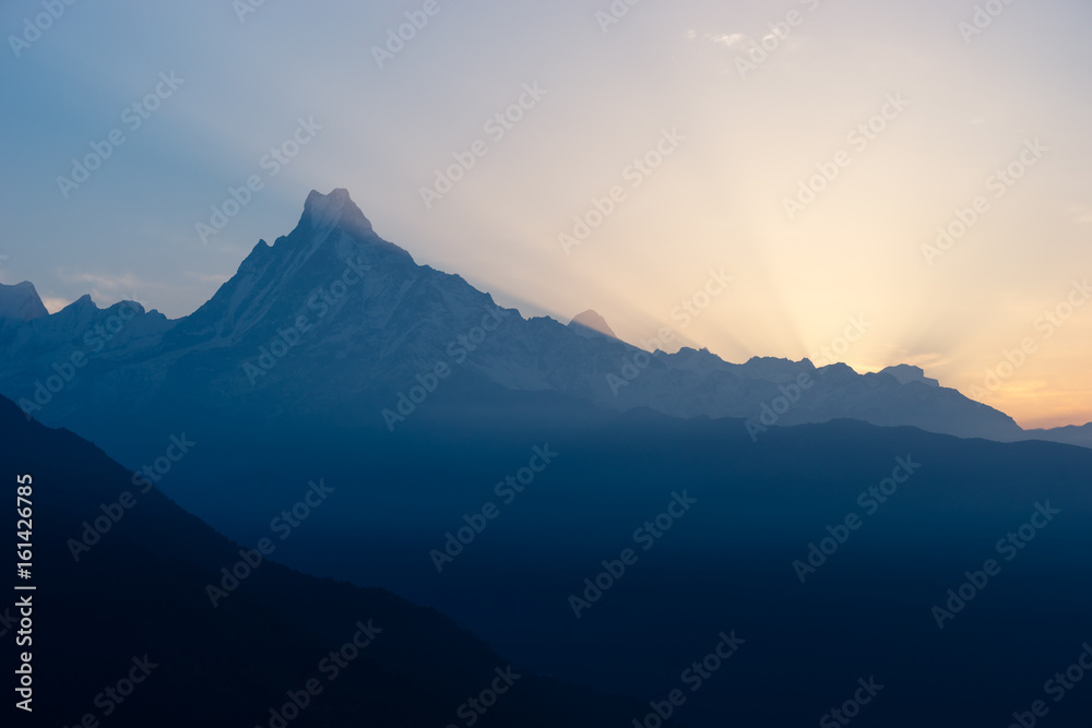 Silhouette of Machapuchre (Fish tail) mountain peak in a morning sunrise, Annapurna trek, Pokhara, Nepal