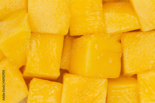 Cut mango for fruit background