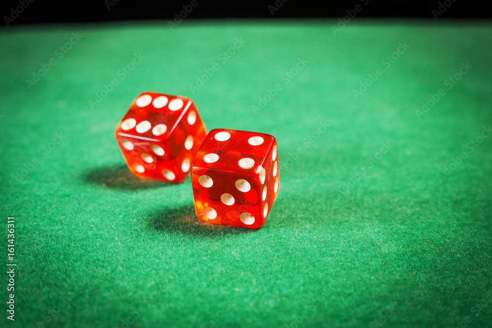 red dice over green surface image close up red dice over green surface image close up