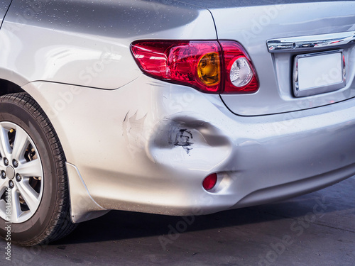 car has dented rear bumper damaged after accident