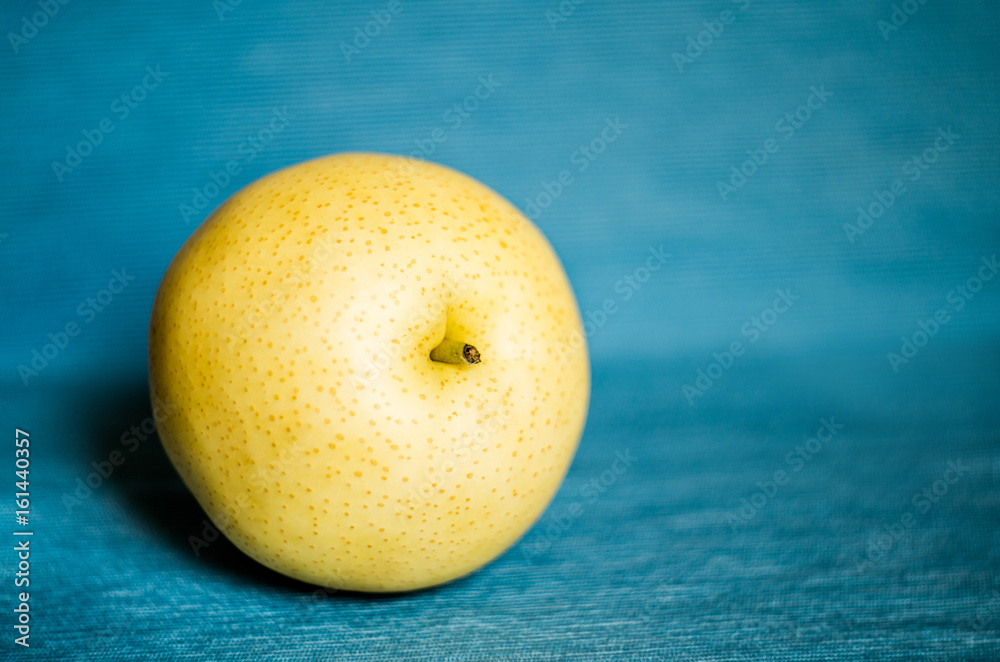 juicy pears isolated on blue table cloth fabric juicy pears isolated on blue table cloth fabric