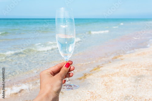 Glass of wine on beach