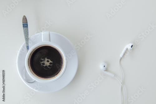 coffee and Earphone  on wood table white background,top view