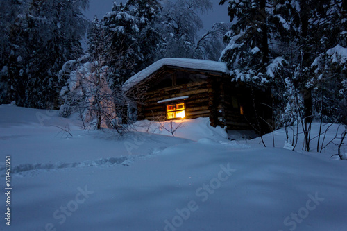 A secluded hut deep in the winter forest