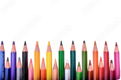 Many colored pencils isolated on white background, place for text