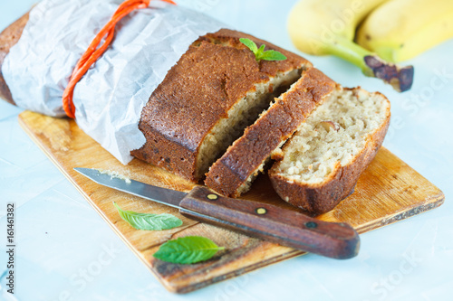 Pieces of banana bread on a wooden board. Love for a healthy vegan food concept