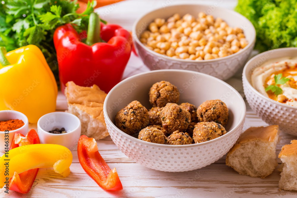 Falafel, pita, hummus and chickpea with vegetables. horizontal view Falafel, pita, hummus and chickpea with vegetables. horizontal view