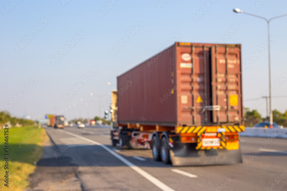 Abstract blurred image of Truck on road. Cargo transportation.