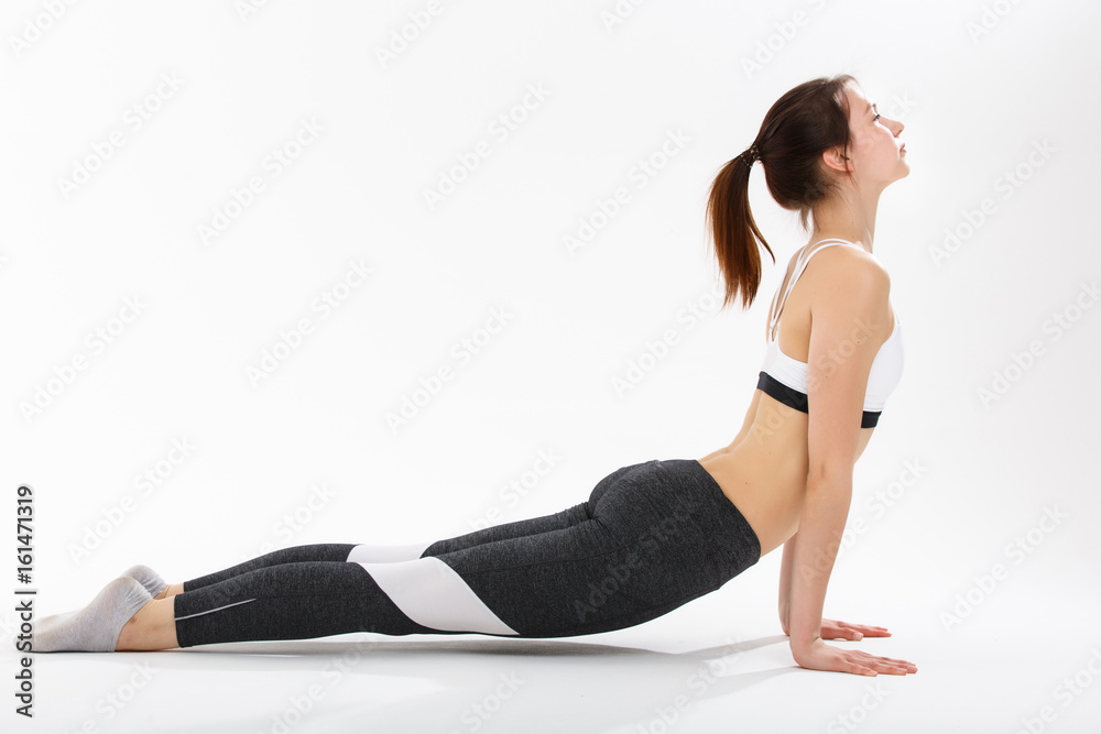 Young woman exercise yoga supported headstand