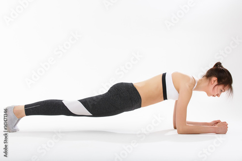 Young woman exercise yoga supported headstand