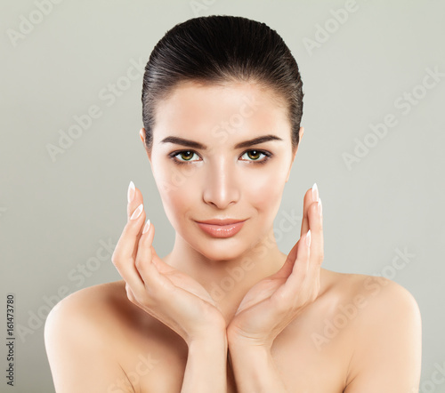 Spa Girl. Beautiful Model Woman with Healthy Skin, Cute Face and French Manicure. Spa Beauty and Cosmetology Concept