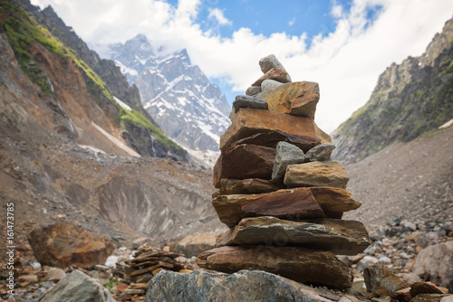 Zen stones in mountain gorge on the background of rocky peaks © sanechka