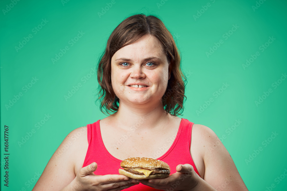 1074366 Hamburger, meal, woman with a hamburger, hungry woman on a green background