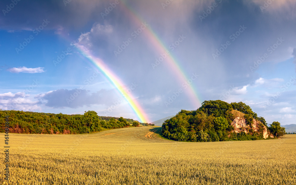 Landscape after a storm with dramatic sky and rainbow. Landscape after a storm with dramatic sky and rainbow.