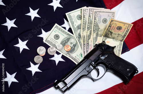 Flag of the USA with gun and money