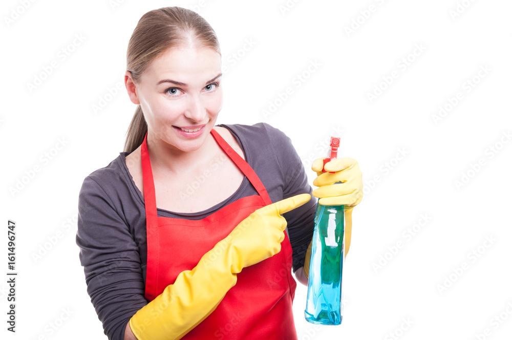 Pretty smiling housekeeper with cleaning spray Pretty smiling housekeeper with cleaning spray