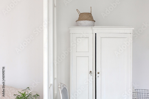White wardrobe and chair